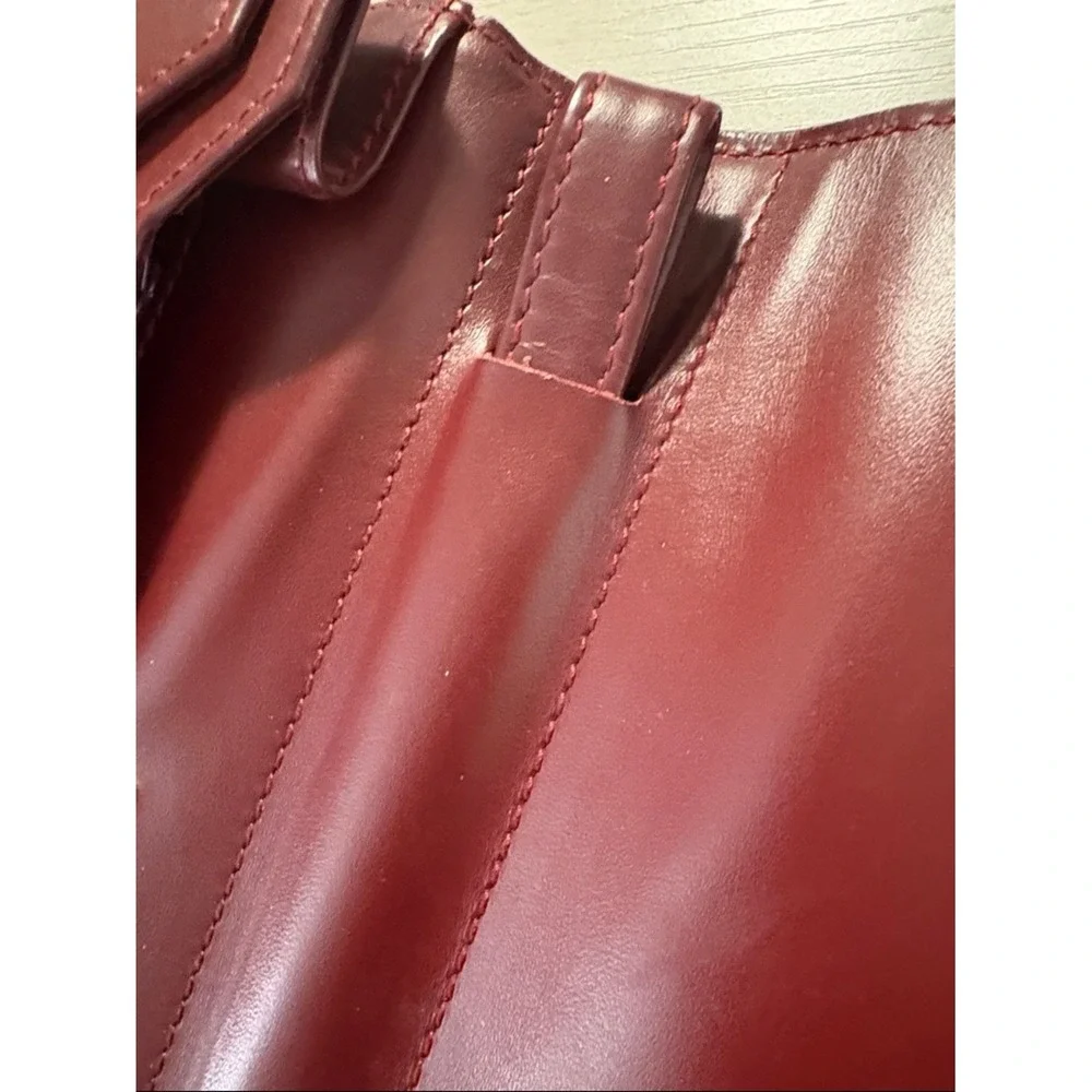 Cartier Burgundy Leather wristlet with Gold Corners‎